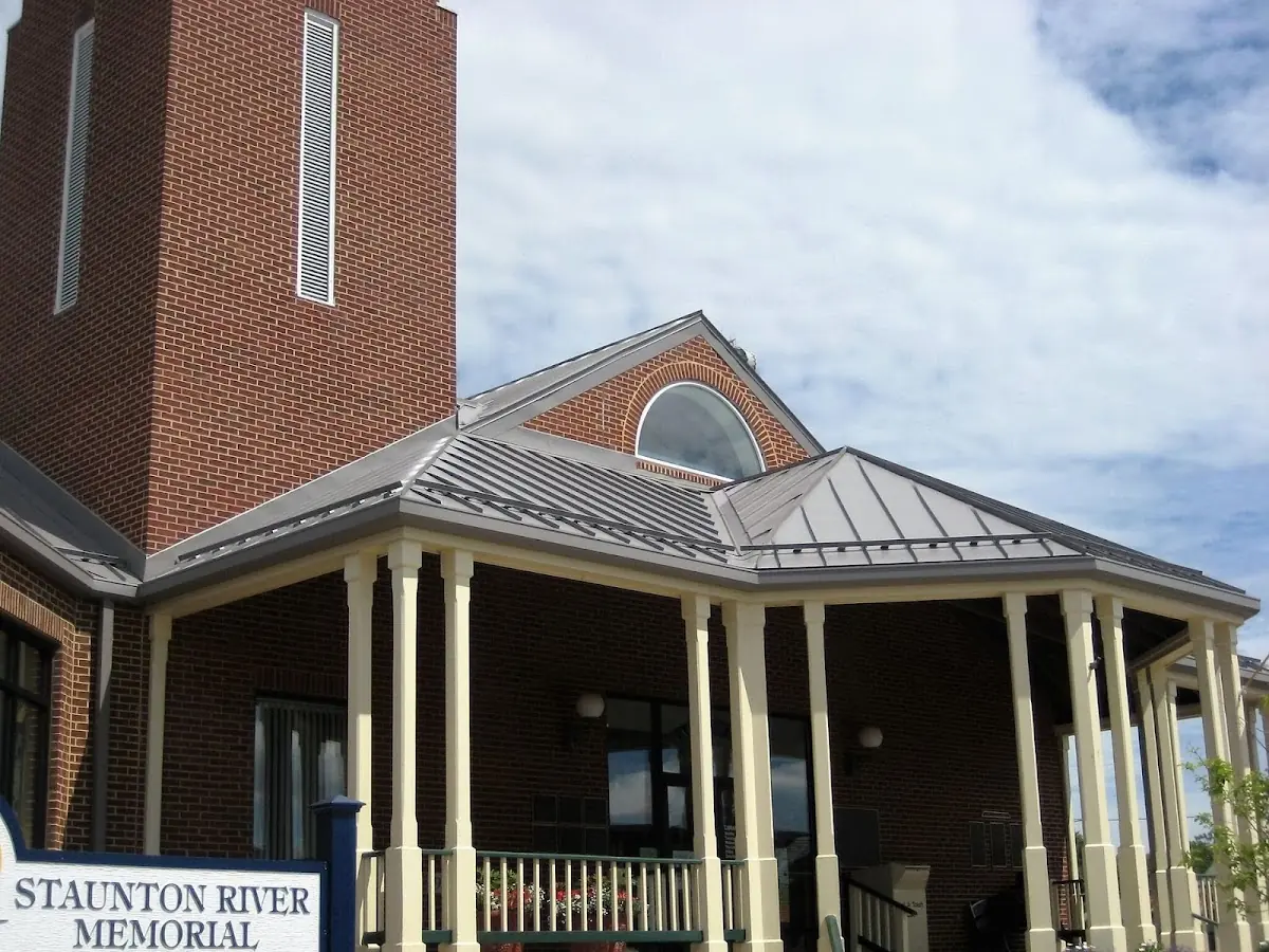 Skilled roofing craftsmen working on a residential roof in Kirkville